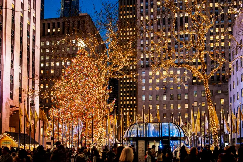 People enjoying Rockefeller Center Tree during Holiday Season in NYC 