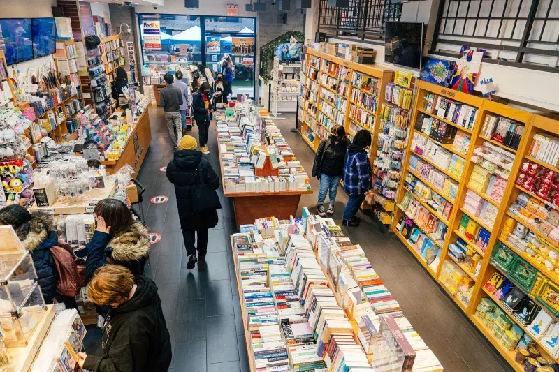 People looking at books, in Koryo Books