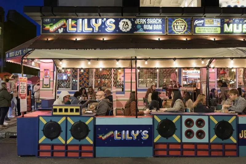 Miss Lily’s 7A, exterior, at night