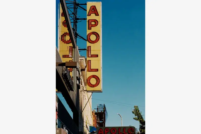 Apollo Theater marquee against blue sky in Harlem, Manhattan