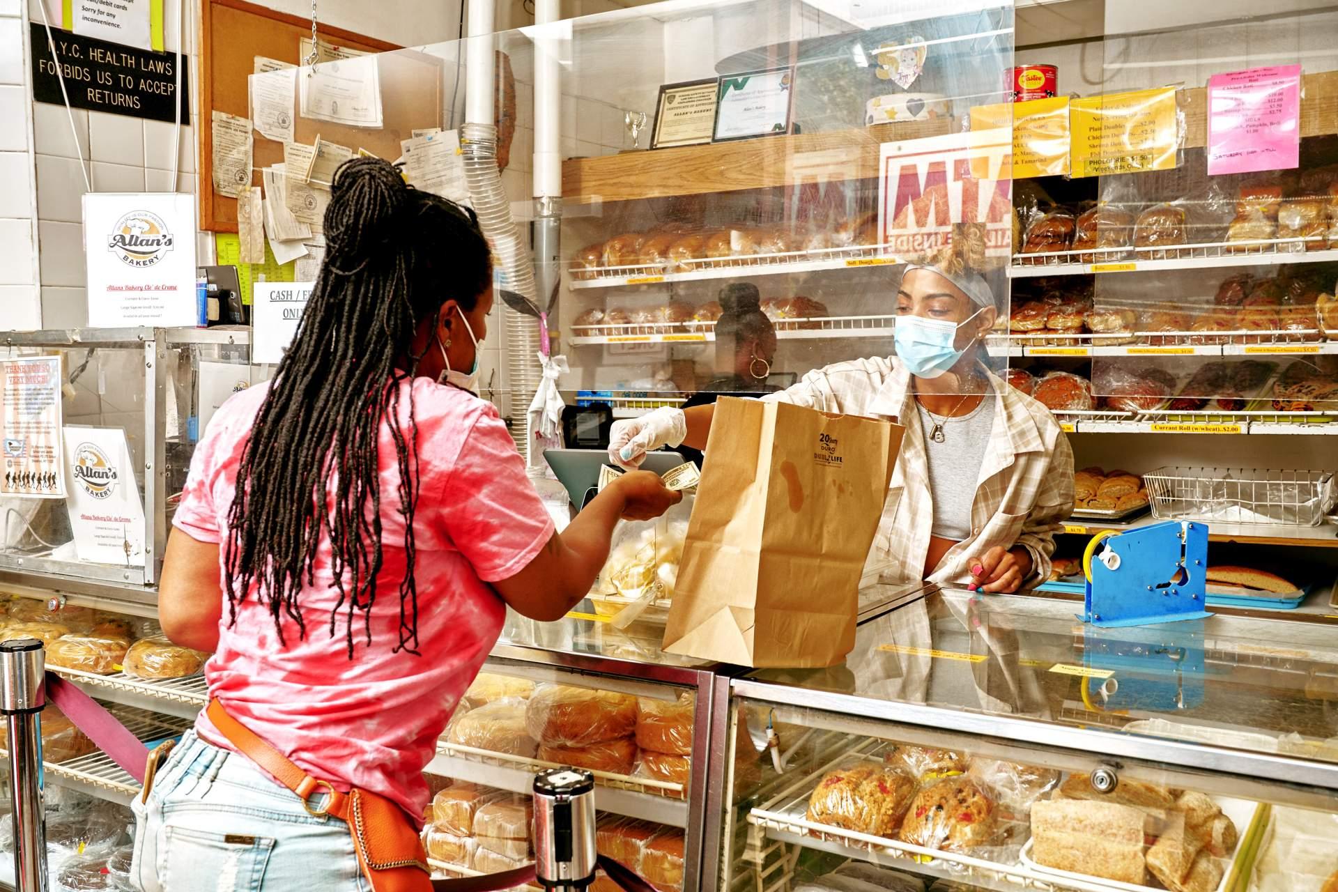two people at, allens bakery, Flatbush