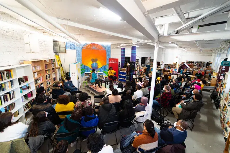 people sittin at an event, inside Word Up Community Bookshop