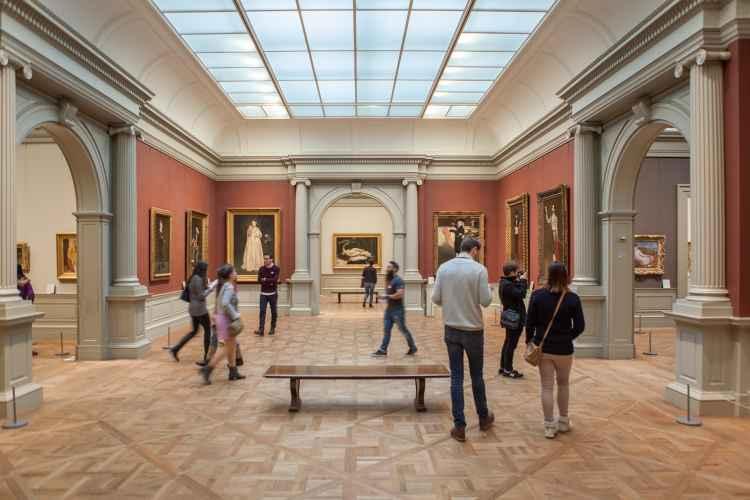 People inside gallery at the Metropolitan Museum of Art looking at art, Upper East Side, NYC