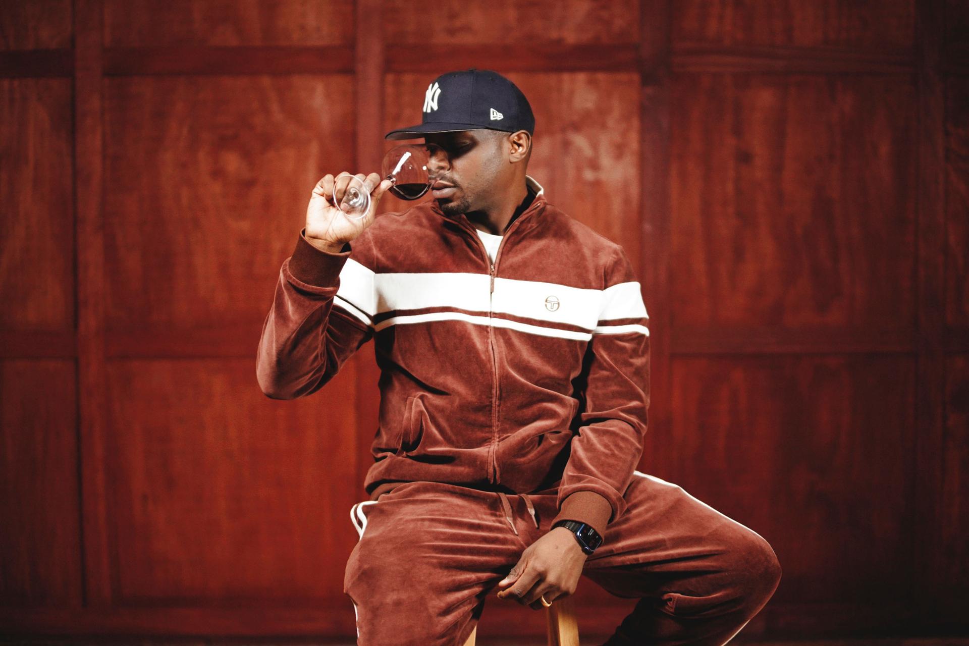 Portait of Jermaine Stone drinking wine