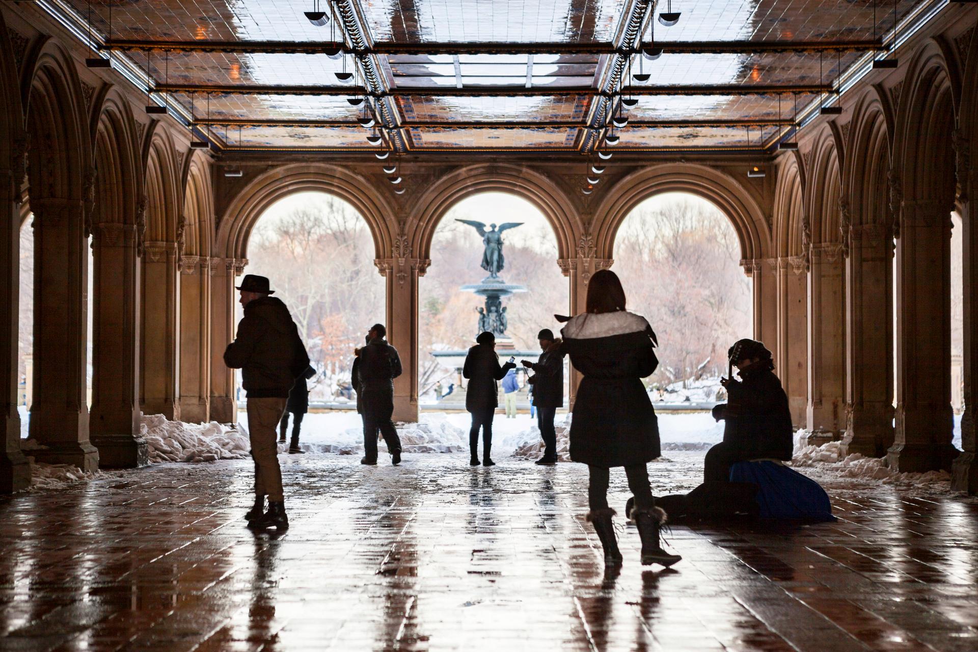 People walking near Bethesda Fountain in Central Park