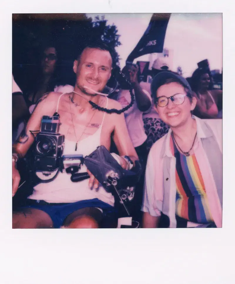 Polaroid of photographer Robert Andy Coombs with other people