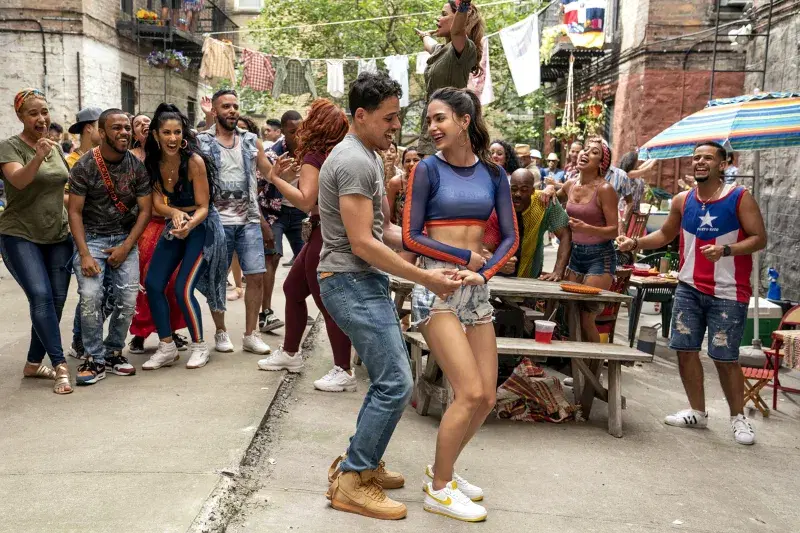 Anthony Ramos (center left) as Usnavi and Melissa Barrera (center right) as Vanessa in Warner Bros. Pictures’ “In The Heights.”
Photo: Macall Polay
