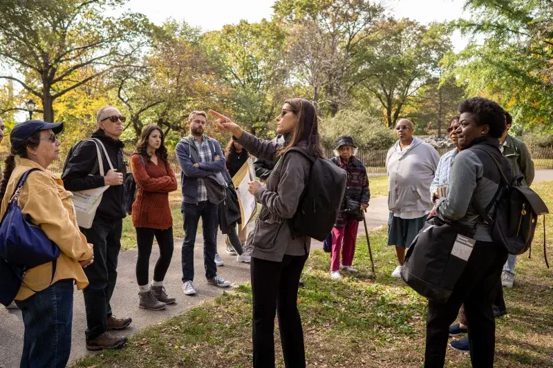 People gather to learn about the history of Seneca Village at Central Park in Manhattan