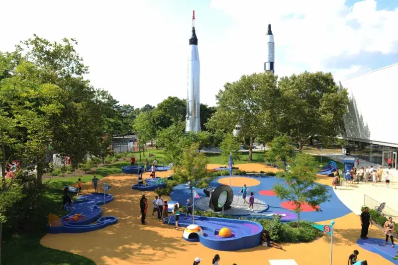 children playing outside of New York Hall of Science
