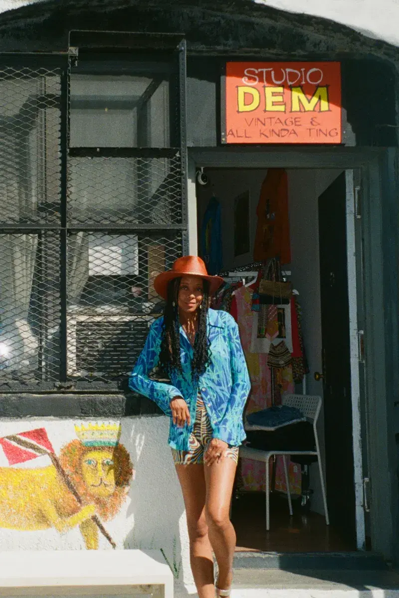 Portrait of Studio Dem's owner at the exterior of the shop