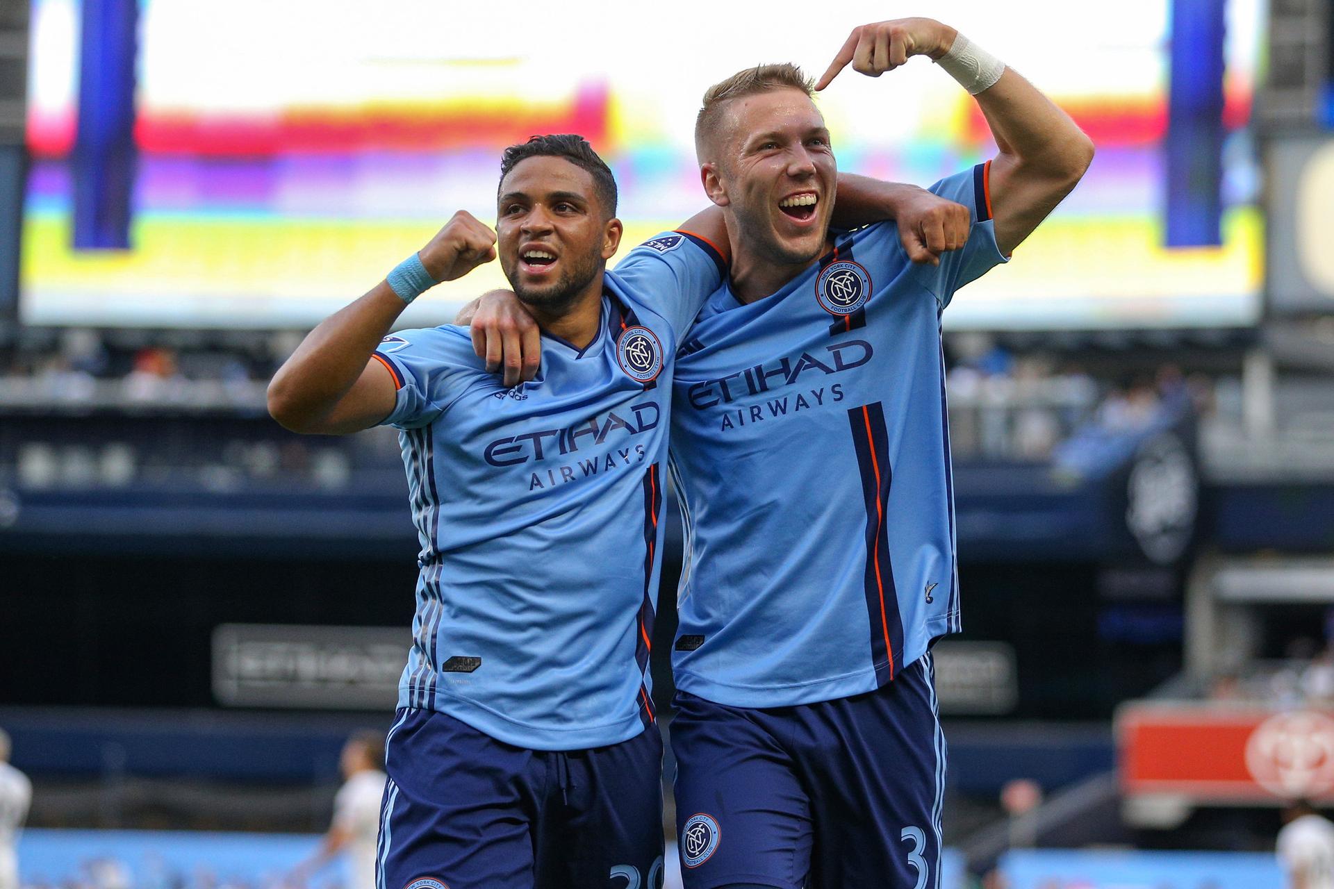 Two soccer players celebrate,  New York City Football Club, at the Yankee Stadiumin, in The Bronx