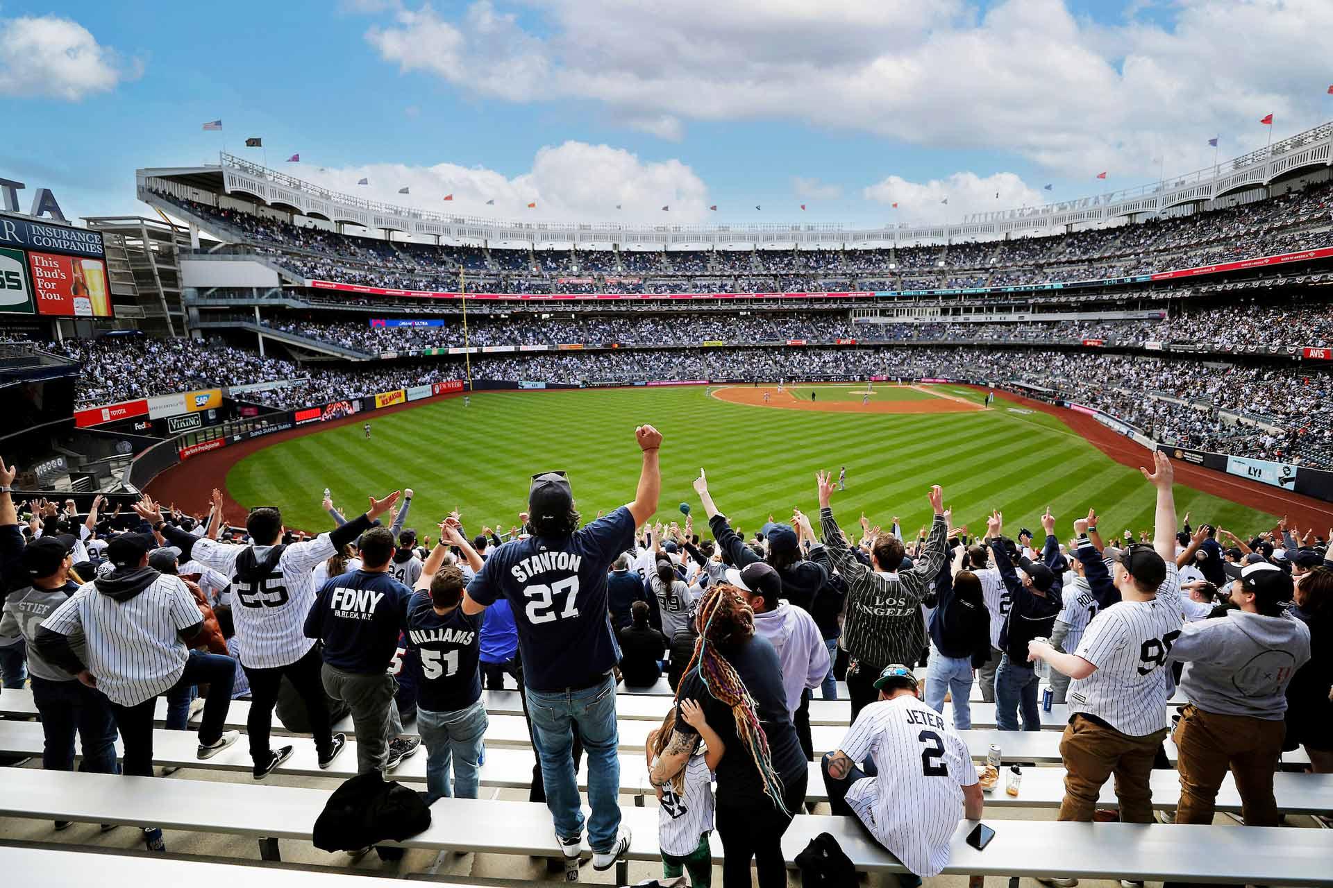 Fans cheering at yankee stadium