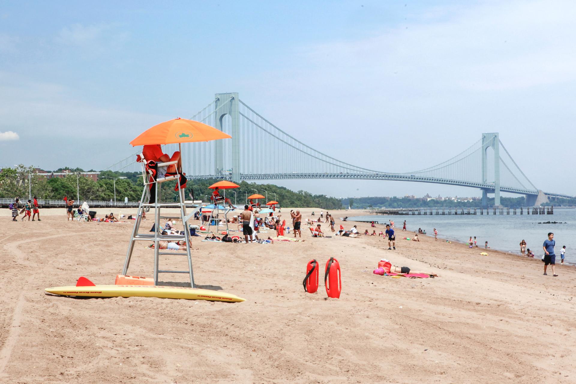 A lifeguard at South Beach,  Verrazano-Narrows Bridge in the background, in Staten Island 