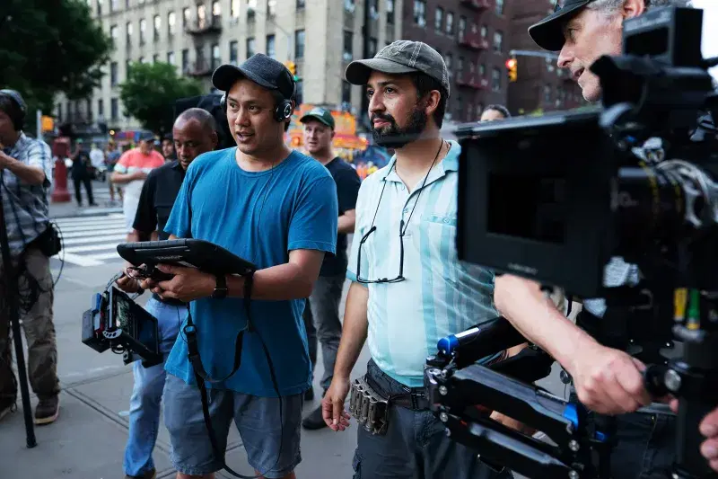Director Jon M. Chu (left center) and concept/music & lyrics/producer Lin-Manuel Miranda (right center) on the set of Warner Bros. Pictures’ “In The Heights.”
Photo: Macall Polay