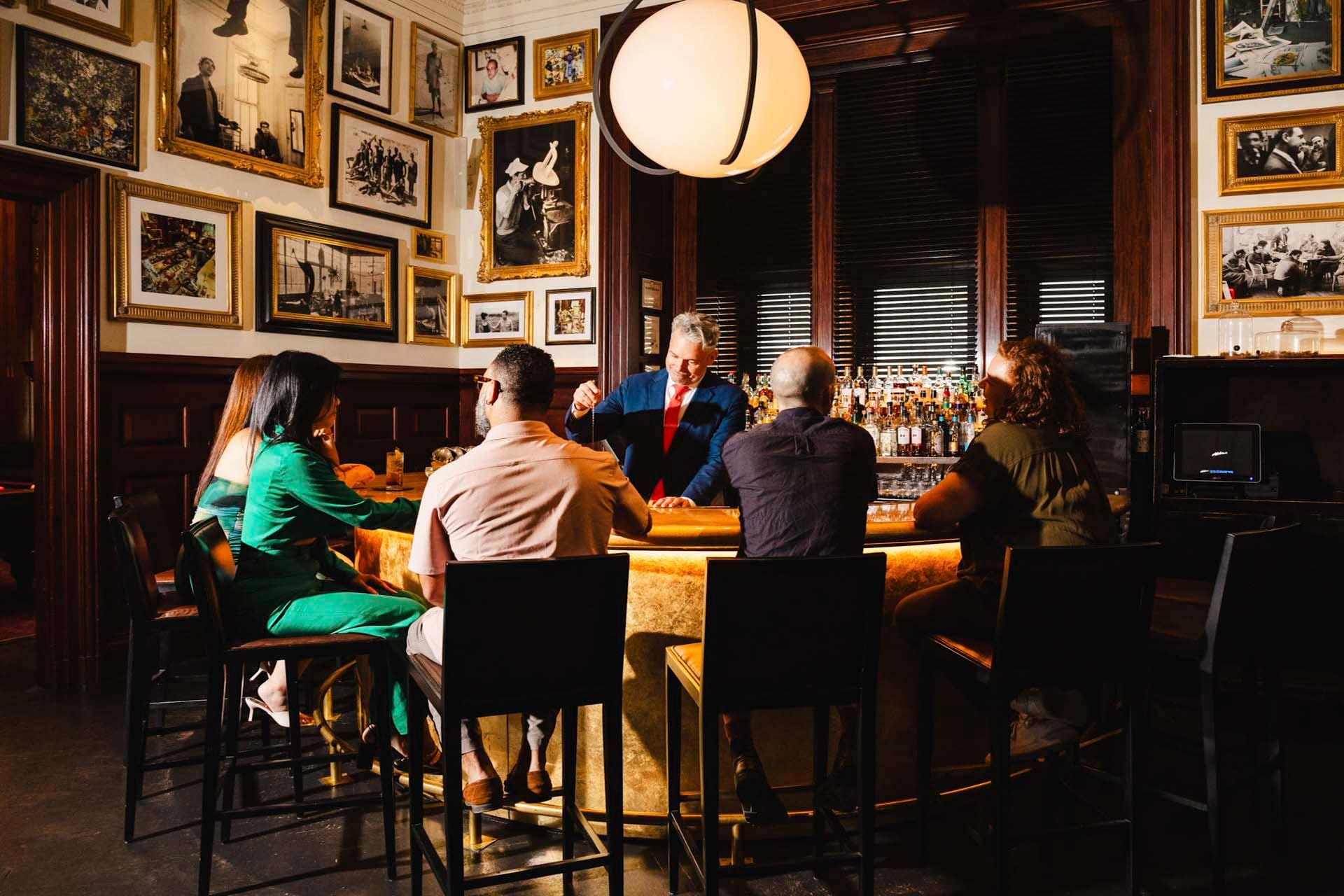 People sitting at bar at The Clocktower