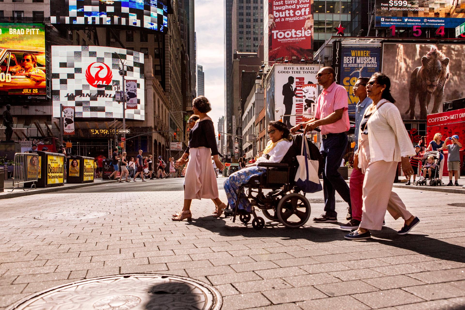 Lakshmee Lachhman-Persad and her sister Annie explore Times Square with their family.