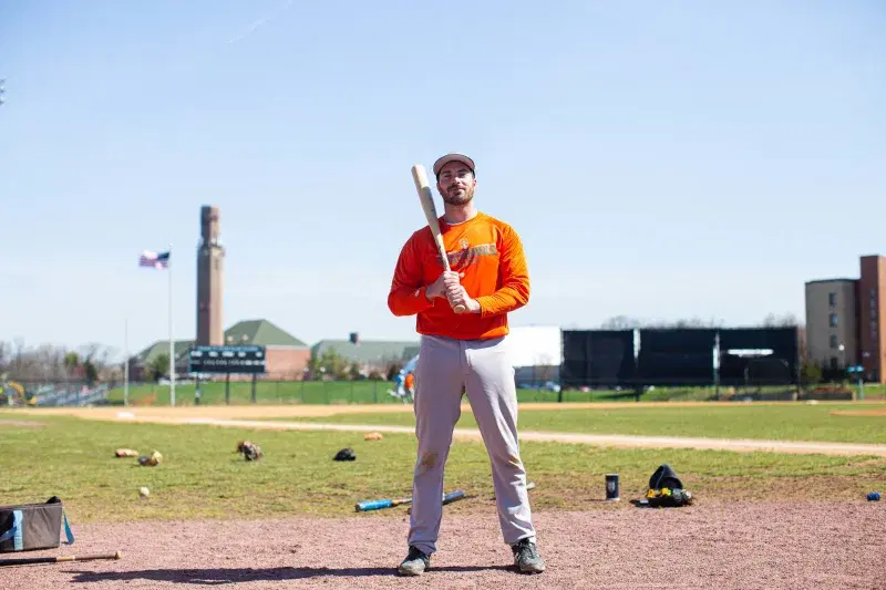 Kevin Krause, a baseball player on the Staten Island Ferry Hawks, holding a baseball bat 