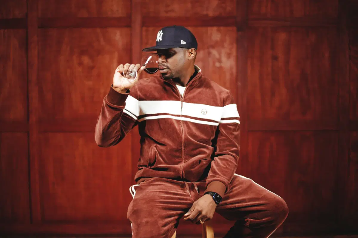 Portait of Jermaine Stone drinking wine