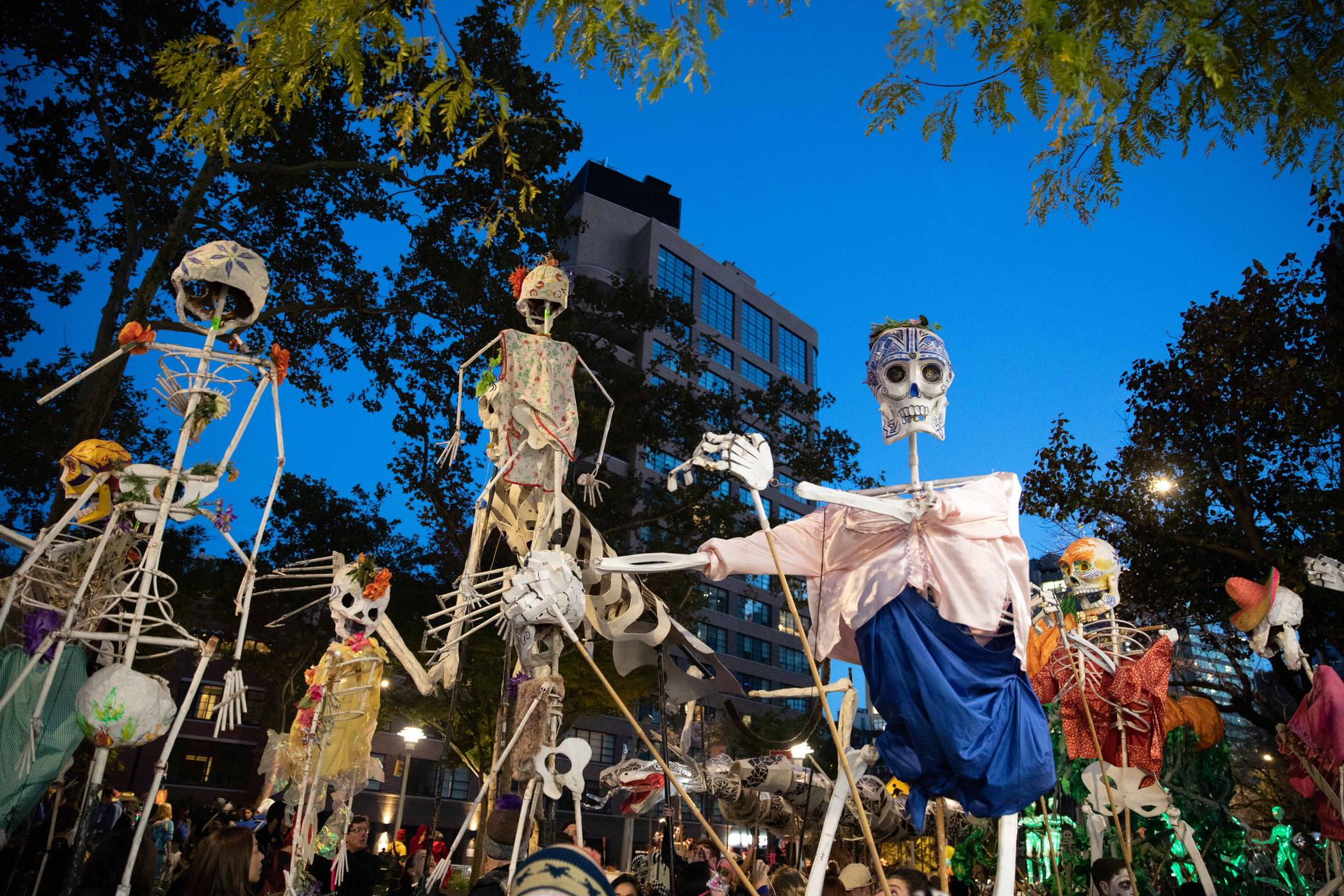 skeletons against blue skies at the halloween parade