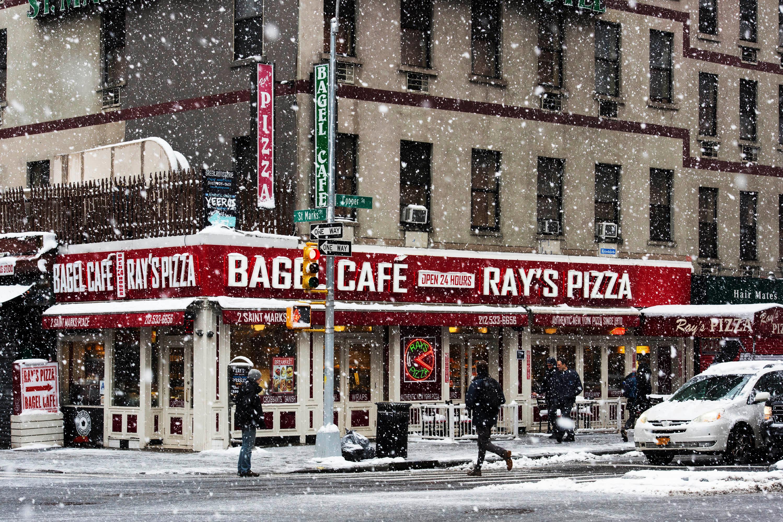 snow falling in front of Bagel Cafe in East Village, Manhattan