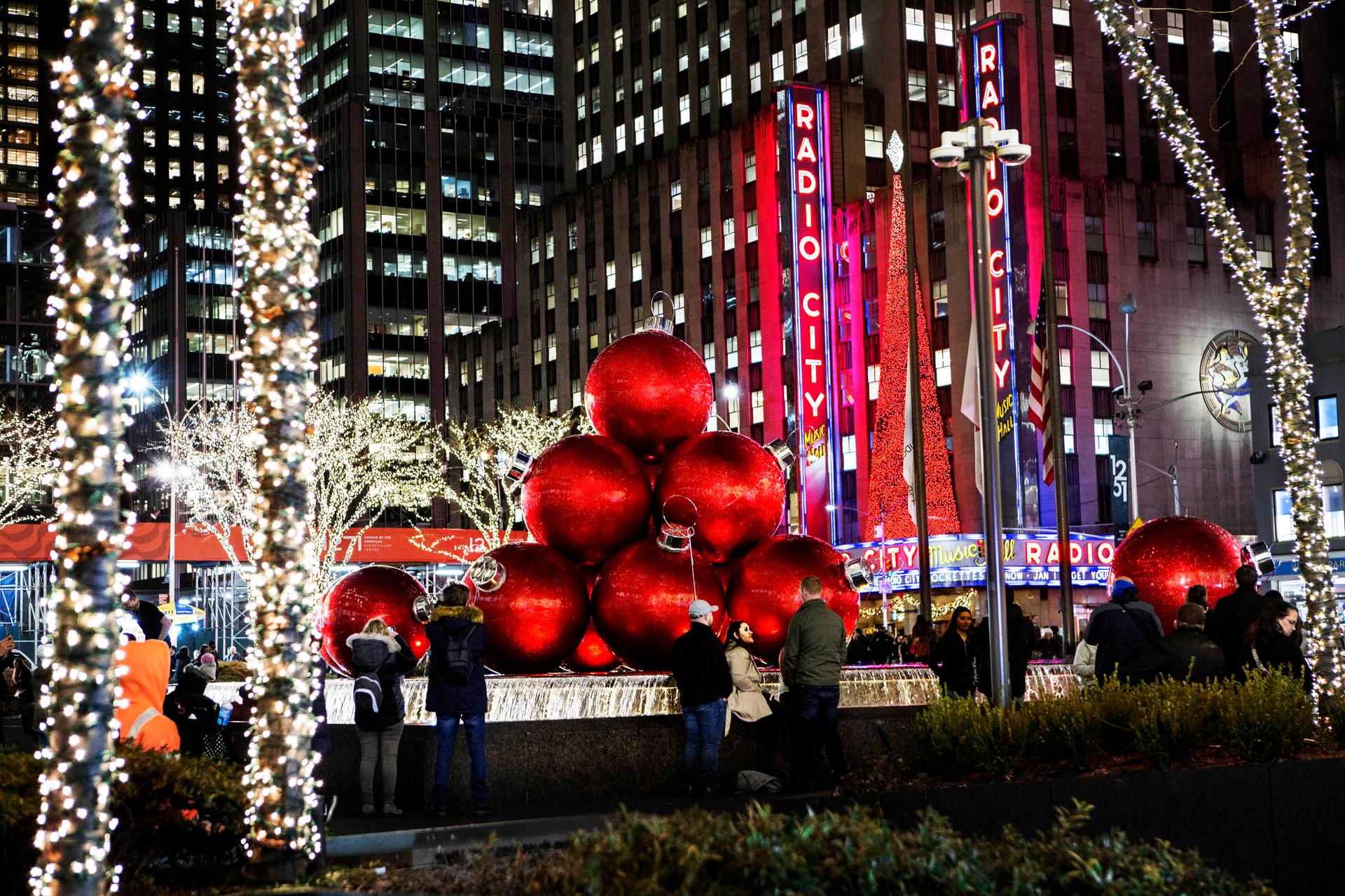 Holiday decor at dusk in Midtown, Radio city in the background