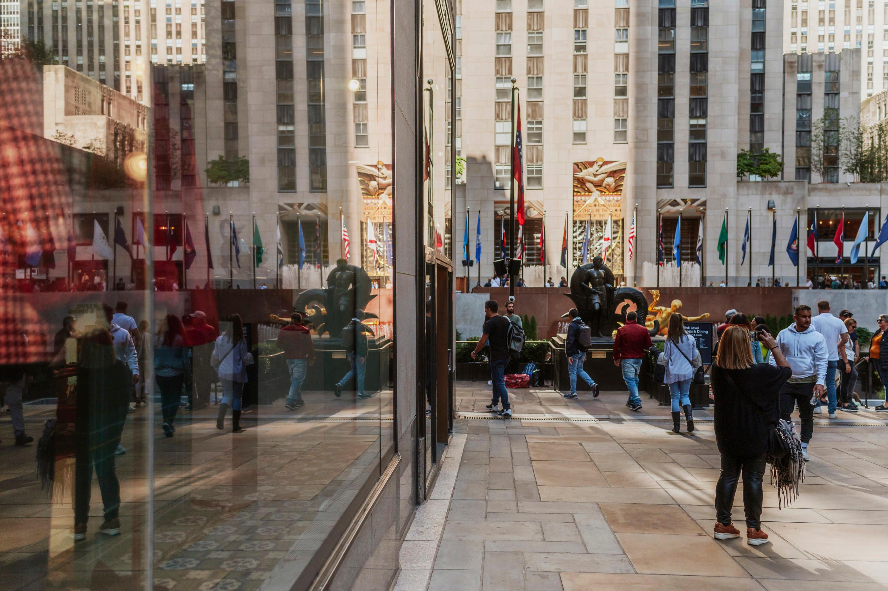 Rockefeller Center Reflected in storefront window in Midtown, Manhattan