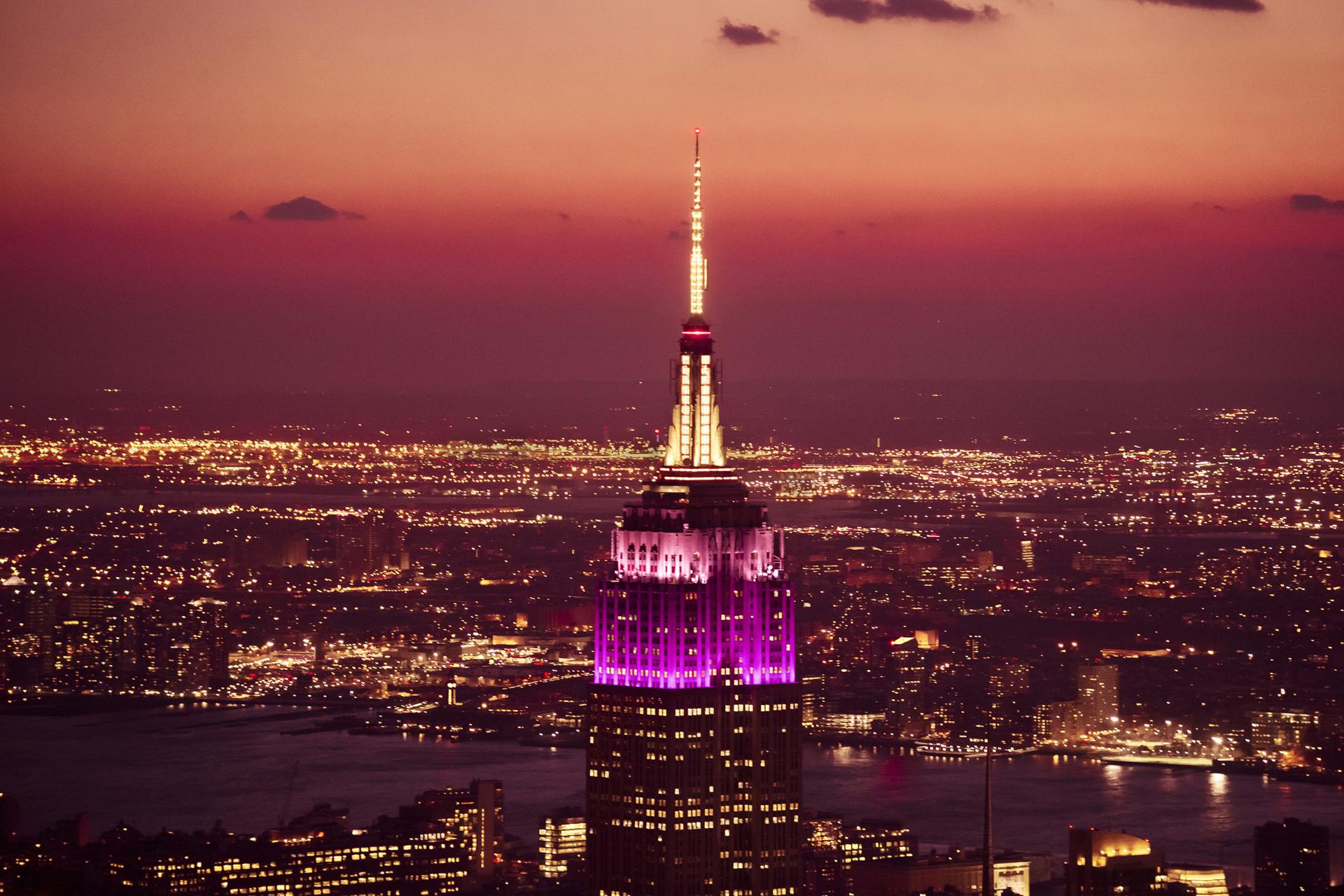 View of the Empire State Building observatory at dusk in Manhattan, NYC