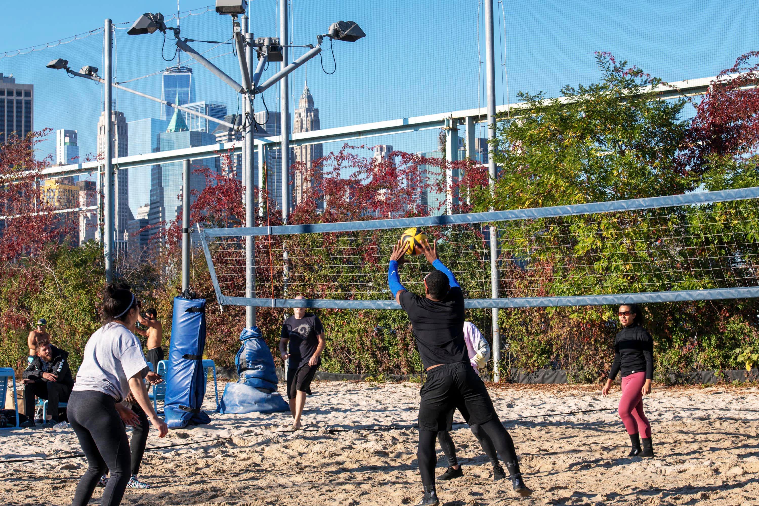 people play Volleyball, Volleyball Courts, brooklyn bridge park, dumbo