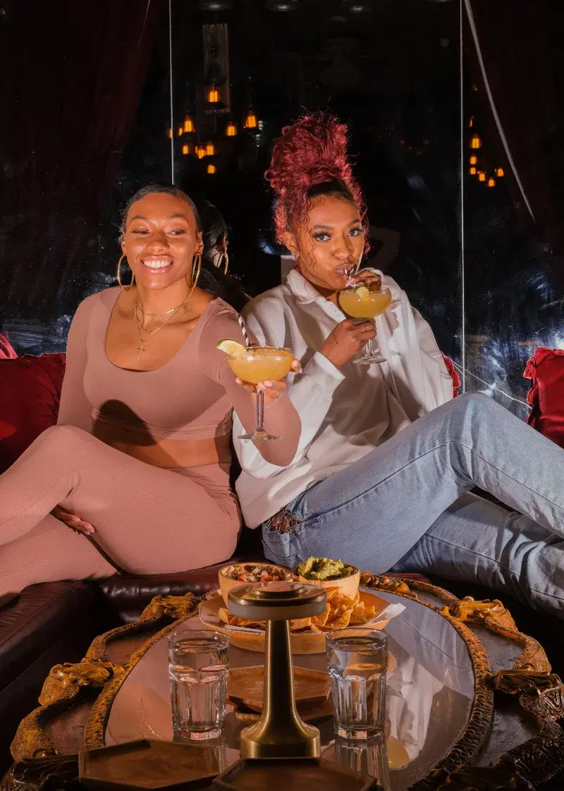 Portrait of Betnijah Laney and Didi Richards of the New York Liberty at "Los Dos Hermanos", a Mexican restaurant in Brooklyn